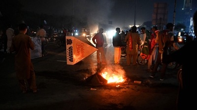 Supporters of Imran Khan take part in a protest against the assassination attempt on Khan, outside the hospital where Khan is admitted, in Lahore. (AFP) Supporters of Imran Khan take part in a protest against the assassination attempt on Khan, outside the hospital where Khan is admitted, in Lahore. (AFP)