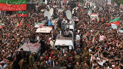 Supporters of Pakistan's former prime minister Imran Khan take part of an anti-government march towards capital Islamabad, demanding early elections, in Gujranwala on November 1. (AFP) Supporters of Pakistan's former prime minister Imran Khan take part of an anti-government march towards capital Islamabad, demanding early elections, in Gujranwala on November 1. (AFP)