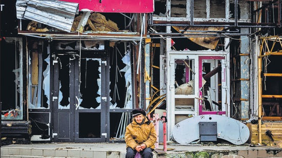 An elderly woman waits for distribution of humanitarian aid in the town of Izyum, in Kharkiv region, amid the Russian invasion of Ukraine. (AFP) An elderly woman waits for distribution of humanitarian aid in the town of Izyum, in Kharkiv region, amid the Russian invasion of Ukraine. (AFP)