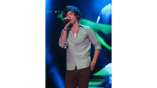 Harry Styles. He got a start in music by auditioning as a solo contestant on the British music competition series The X Factor in 2010.(Wikimedia Commons)