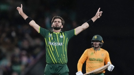 Pakistan's Shaheen Afridi celebrates after dismissing South Africa's Quinton de Kock, right, during the T20 World Cup cricket match between Pakistan and South Africa in Sydney, Australia, Thursday, Nov. 3, 2022. (AP Photo/Rick Rycroft)(AP)
