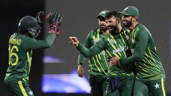 Pakistan's Shadab Khan, second right, is congratulated by teammates after dismissing South Africa's Aiden Markram during the T20 World Cup cricket match between Pakistan and South Africa in Sydney, Australia, Thursday, Nov. 3, 2022. (AP Photo/Rick Rycroft)(AP)