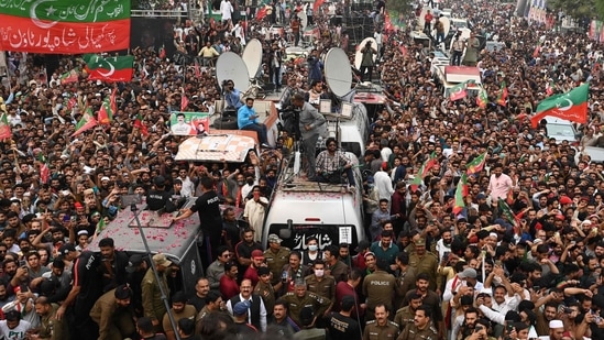 Supporters of Pakistan's former prime minister Imran Khan take part of an anti-government march towards capital Islamabad, demanding early elections, in Gujranwala on November 1.(AFP)