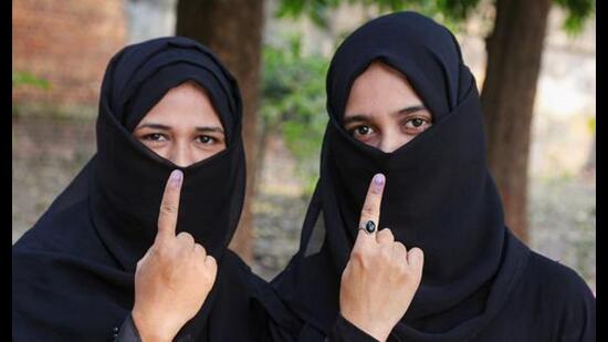 Voters show their ink-marked fingers after casting their votes in Uttar Gola Gokarannath constituency by-elections, in Lakhimpur, Thursday. (PTI Photo)