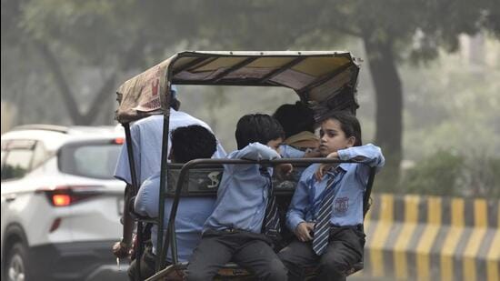 Children return home from school amid rising air pollution, in Noida. The Gautam Budh Nagar Parents Welfare Society has written to the district administration requesting them to make masks mandatory for school students in order to safeguard them from hazardous gases due to pollution.