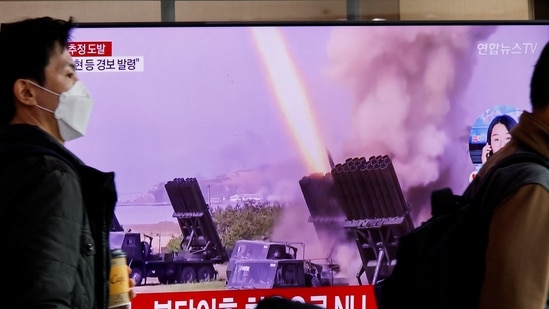 Men walk past a TV broadcasting a news report on North Korea firing a ballistic missile off its east coast, in Seoul, South Korea on Thursday.(REUTERS)