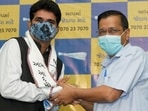 Gujarat's senior journalist Isudan Gadhvi with AAP convener and Delhi CM Arvind Kejriwal. (PTI file) Gujarat's senior journalist Isudan Gadhvi with AAP convener and Delhi CM Arvind Kejriwal. (PTI file)