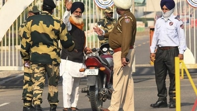 A Sikh pilgrim crosses over to Pakistan to go to the Gurdwara Darbar Kartarpur Sahib in November 2021. (AFP File Photo) A Sikh pilgrim crosses over to Pakistan to go to the Gurdwara Darbar Kartarpur Sahib in November 2021. (AFP File Photo)
