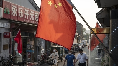 Covid In China: People on a street in Beijing, China. (Bloomberg) Covid In China: People on a street in Beijing, China. (Bloomberg)