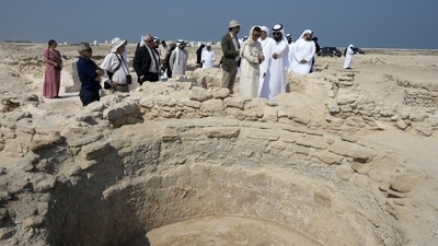 Sheikh Majid bin Saud Al Mualla, chairman of the Umm Al Quwain Department of Tourism and Archaeology, front right, explains to Noura Al Kaabi, UAE Minister of Culture and Youth, during a visit of the ancient Christian monastery on Siniyah Island in Umm al-Quwain, United Arab Emirates, November 3. (AP) Sheikh Majid bin Saud Al Mualla, chairman of the Umm Al Quwain Department of Tourism and Archaeology, front right, explains to Noura Al Kaabi, UAE Minister of Culture and Youth, during a visit of the ancient Christian monastery on Siniyah Island in Umm al-Quwain, United Arab Emirates, November 3. (AP)
