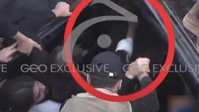 Former Pakistan prime minister Imran Khan's bandaged shin is seen in this screengrab shared by Geo News (Geo News) Former Pakistan prime minister Imran Khan's bandaged shin is seen in this screengrab shared by Geo News (Geo News)