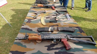 Arms and ammunition recovered from slain Pakistani terrorist in Poonch being displayed to media on Friday. (HT Photo) Arms and ammunition recovered from slain Pakistani terrorist in Poonch being displayed to media on Friday. (HT Photo)