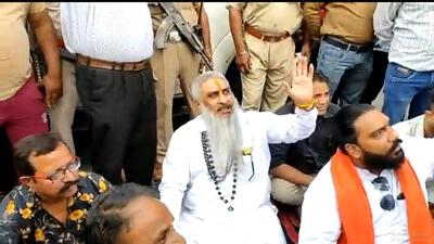 Sudhir Suri (centre) seconds before he was shot dead during a sit-in protest in Amritsar on Friday. (HT photo) Sudhir Suri (centre) seconds before he was shot dead during a sit-in protest in Amritsar on Friday. (HT photo)