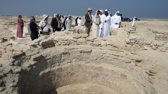 Sheikh Majid bin Saud Al Mualla, chairman of the Umm Al Quwain Department of Tourism and Archaeology, front right, explains to Noura Al Kaabi, UAE Minister of Culture and Youth, during a visit of the ancient Christian monastery on Siniyah Island in Umm al-Quwain, United Arab Emirates, November 3.(AP) Sheikh Majid bin Saud Al Mualla, chairman of the Umm Al Quwain Department of Tourism and Archaeology, front right, explains to Noura Al Kaabi, UAE Minister of Culture and Youth, during a visit of the ancient Christian monastery on Siniyah Island in Umm al-Quwain, United Arab Emirates, November 3.(AP)