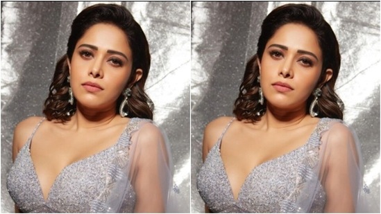 Styled by fashion stylist Nidhi Jeswani, Nushrratt wore her tresses open in a dewy back brushed look with a side part. (Instagram/@nushrrattbharuccha)