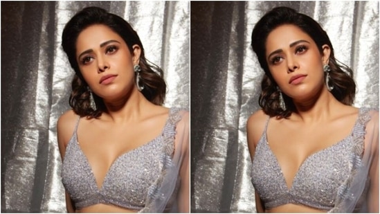 In statement silver earrings with embedded stones from the shelves of Anayah Jewellery, Nushrratt perfectly accessorised her look for the day. (Instagram/@nushrrattbharuccha)