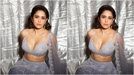 Nushrratt teamed a sleek slip silver blouse with a plunging neckline and sequin details with a long flowy silver sequined skirt with heavy embellishment details. (Instagram/@nushrrattbharuccha)