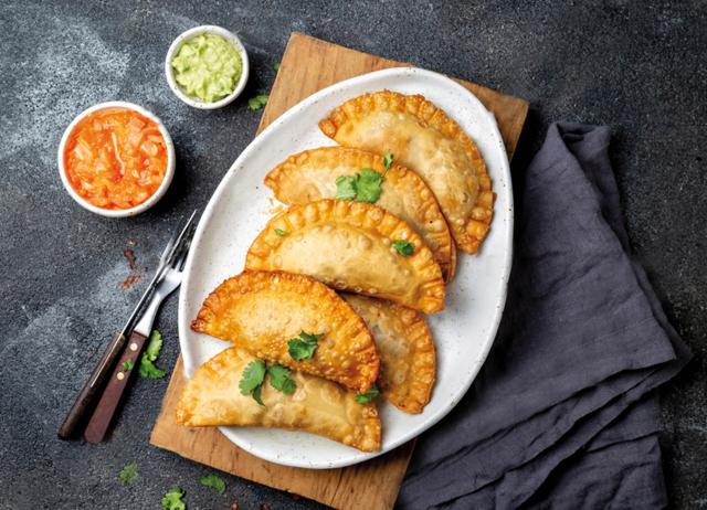 In Valencia, the middle-eastern sanbusak became the empanada. The empanada travelled on its own journeys. (Shutterstock) In Valencia, the middle-eastern sanbusak became the empanada. The empanada travelled on its own journeys. (Shutterstock)