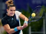 Maria Sakkari, of Greece, hits a return to Ons Jabeur, of Tunisia, during round-robin play on Day 5 of the WTA Finals