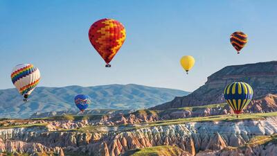 The early morning hot air balloon ride in Cappadocia takes you up in the air for about one hour, and offers a view of the region’s unique rock formations The early morning hot air balloon ride in Cappadocia takes you up in the air for about one hour, and offers a view of the region’s unique rock formations