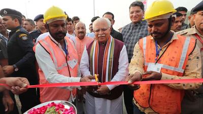Gurugram, India- November 05: Chief Minister Manohar Lal Khattar cut the ribbon with workers during the inauguration of the newly built Basai Chowk flyover and foot-over-bridge at Basai village near Greenwood School, in Gurugram, India, on Saturday, November 05, 2022. (Photo by Parveen Kumar/ Hindustan Times) Gurugram, India- November 05: Chief Minister Manohar Lal Khattar cut the ribbon with workers during the inauguration of the newly built Basai Chowk flyover and foot-over-bridge at Basai village near Greenwood School, in Gurugram, India, on Saturday, November 05, 2022. (Photo by Parveen Kumar/ Hindustan Times)