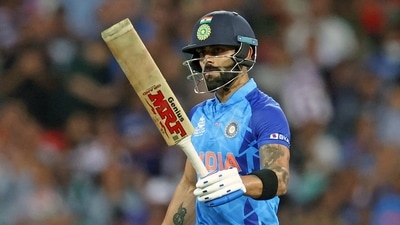 India's Virat Kohli raises his bat after completing his fifty during the ICC Men's T20 World Cup 2022 match against Bangladesh, at Adelaide Oval (ANI) India's Virat Kohli raises his bat after completing his fifty during the ICC Men's T20 World Cup 2022 match against Bangladesh, at Adelaide Oval (ANI)