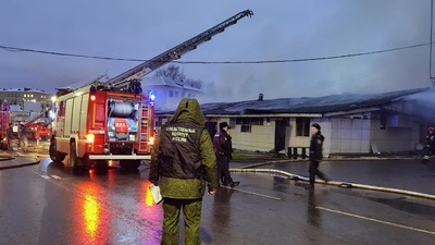 This handout picture taken and released by the Russian Investigative Committee shows police officers and investigators working at a cafe in Kostroma destroyed by a fire. (AFP)