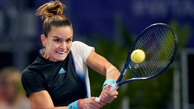 Maria Sakkari, of Greece, hits a return to Ons Jabeur, of Tunisia, during round-robin play on Day 5 of the WTA Finals (AP) Maria Sakkari, of Greece, hits a return to Ons Jabeur, of Tunisia, during round-robin play on Day 5 of the WTA Finals (AP)
