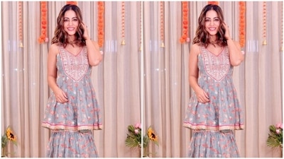 Hina accessorised the ensemble with an ornate gold choker necklace and a statement ring. Lastly, centre-parted open tresses with wavy ends rounded off Hina Khan's hairdo with the traditional look. (Instagram) Hina accessorised the ensemble with an ornate gold choker necklace and a statement ring. Lastly, centre-parted open tresses with wavy ends rounded off Hina Khan's hairdo with the traditional look. (Instagram)