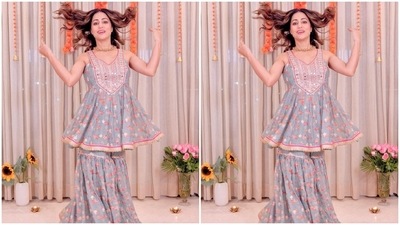 Regarding the design details, Hina Khan's sleeveless kurti from the gharara set features a floral print in pink and ivory hues. It also has a V neckline adorned in mirror embellishments, threadwork and patti embroidery, a cinched detail below the bust, a fit and flare silhouette, contrast pink lining, and scalloped gold gota patti borders. (Instagram) Regarding the design details, Hina Khan's sleeveless kurti from the gharara set features a floral print in pink and ivory hues. It also has a V neckline adorned in mirror embellishments, threadwork and patti embroidery, a cinched detail below the bust, a fit and flare silhouette, contrast pink lining, and scalloped gold gota patti borders. (Instagram)