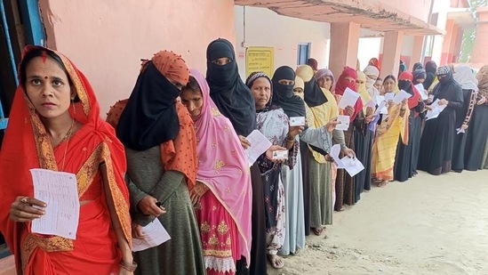 Women voters wait in a queue to cast their votes for assembly bypolls in Bihar's Gopalganj assembly constituency on Thursday. (ANI)