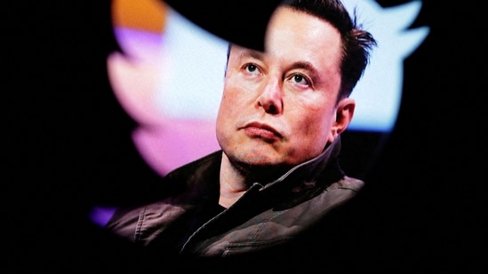 Elon Musk's photo is seen through a Twitter logo in this illustration. (REUTERS)
