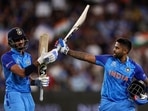 Suryakumar Yadav and Axar Patel leave the field after India's innings against Zimbabwe during the ICC T20 World Cup 2022(AFP)