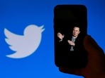 Elon Musk Twitter Takeover: A phone screen displays a photo of Elon Musk with the Twitter logo.(AFP) Elon Musk Twitter Takeover: A phone screen displays a photo of Elon Musk with the Twitter logo.(AFP)