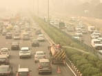 A view of traffic moving under heavy smog in Delhi-NCR.