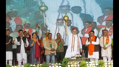 Union home minister Amit Shah holds a mace during a public meeting in Nagrota Bagwan in Kangra district on Sunday. (PTI)