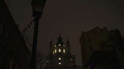 Russia-Ukraine War: Windows of St. Andrew's Church are illuminated during a blackout in Kyiv, Ukraine. (AP) Russia-Ukraine War: Windows of St. Andrew's Church are illuminated during a blackout in Kyiv, Ukraine. (AP)