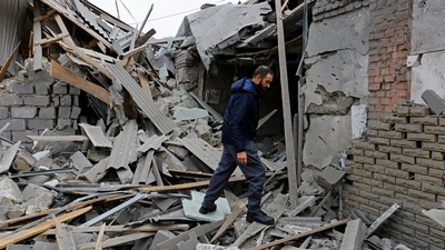 Russia-Ukraine War: Local resident walks on the ruins of a house destroyed by recent shelling in Donetsk. (Reuters)