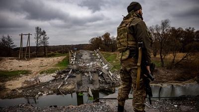 Russia-Ukraine War: A Ukrainian serviceman stands at destroyed bridge near the Ukrainian border with Russia. (AFP) Russia-Ukraine War: A Ukrainian serviceman stands at destroyed bridge near the Ukrainian border with Russia. (AFP)