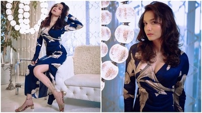 Ankita accessorised the ensemble with minimal pieces, including statement earrings and gold block heels featuring gladiator-style ties. Lastly, side-parted open tresses with wavy ends completed her hairdo.  (Instagram)