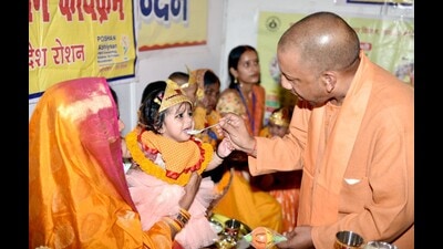 Uttar Pradesh chief minister Yogi Adityanath feeding a baby during his visit to Chandauli on Sunday. (Sourced) Uttar Pradesh chief minister Yogi Adityanath feeding a baby during his visit to Chandauli on Sunday. (Sourced)