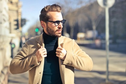 Turtlenecks are softer and more flexible than dress shirts, making them more comfortable while maintaining a polished appearance. (Unsplash)