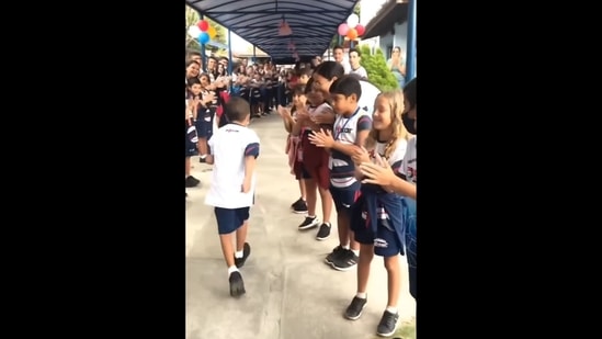 The image, taken from the video posted on Instagram, shows Bernardo receiving a warm welcome as he returns to school after beating cancer. (Instagram/@goodnewscorrespondent)