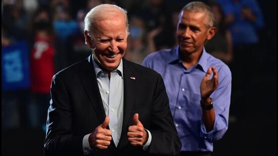 President Joe Biden (left) and former US president Barack Obama (right) rally for Pennsylvania Democratic Senate nominee John Fetterman and Democratic gubernatorial nominee Josh Shapiro at the Liacouras Center on Saturday in Philadelphia. (AFP)