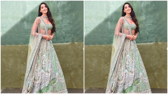 Nora decked up in a pastel green blouse with golden sequin details and teamed it with a long and flowy skirt with white zari details throughout. In a sheer dupatta with white zari details at the borders, Nora aced the look. (Instagram/@norafatehi)