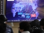 A TV screen showing a news program reporting on North Korea's missile launch at the Seoul Railway Station. A TV screen showing a news program reporting on North Korea's missile launch at the Seoul Railway Station.