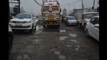 The pothole riddled road opposite SPS Apollo Hospital in Sherpur Chowk, Ludhiana. (Harvinder Singh/HT)