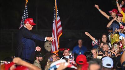 Former US president Donald Trump gestures as he leaves after speaking at a ‘Save America’ rally in support of US Senator Marco Rubio (Republican-Florida) ahead of the midterm elections at Miami-Dade County Fair and Exposition in Miami, Florida, on Sunday. (AFP)
