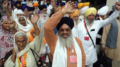 Sikh pilgrims entering Pakistan through the Attari-Wagah border near Lahore on Sunday. Hundreds of Indian Sikh pilgrims arrived in Pakistan to celebrate the birth anniversary of Sikhism founder Guru Nanak at his birthplace at Nankana Sahib near Lahore. (PTI Photo) Sikh pilgrims entering Pakistan through the Attari-Wagah border near Lahore on Sunday. Hundreds of Indian Sikh pilgrims arrived in Pakistan to celebrate the birth anniversary of Sikhism founder Guru Nanak at his birthplace at Nankana Sahib near Lahore. (PTI Photo)
