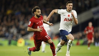 Liverpool's Mohamed Salah, left, challenges for the ball with Tottenham's Clement Lenglet (AP) Liverpool's Mohamed Salah, left, challenges for the ball with Tottenham's Clement Lenglet (AP)